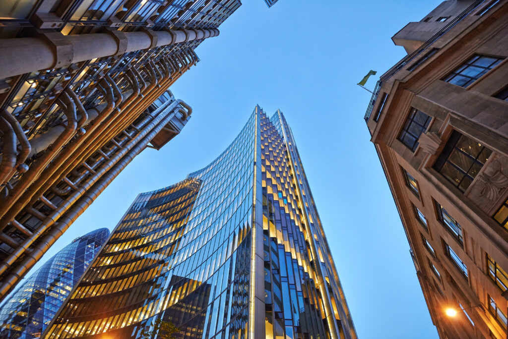 Three different kind of architecture with commercial office buildings exterior. Evening view at bottom skyscrapers.